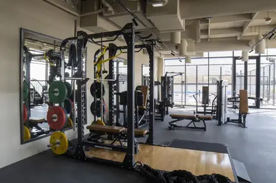 a gym with lots of equipment and a large window at Modern Studio, Burj Views - Business Travelers in Dubai