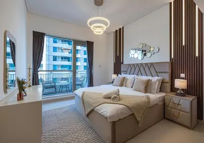 a bedroom with a large bed and a balcony at Luxurious one bedroom Apartment with Burj Khalifa View in Dubai