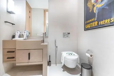 a bathroom with a toilet and a sink at Luxury 2 Bedroom Apartment with Breathtaking Dubai in Dubai