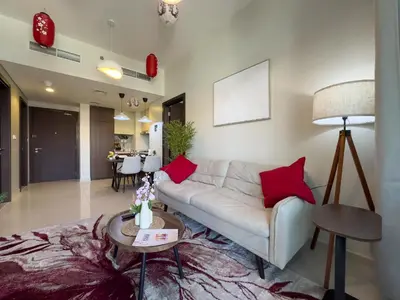 a living room with a white couch and red pillows at japanDXB Burj Khalifa view - 4min Dubai Mall in Dubai
