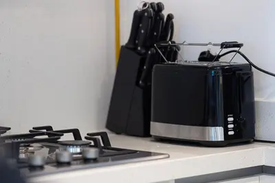 a microwave sitting on a counter next to a stove at Full Burj view & Direct Access to Dubai Mall in Dubai