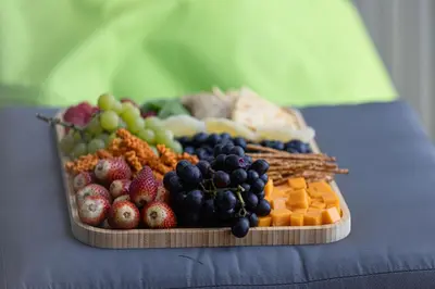 a tray of fruits and vegetables on a table at Full Burj view & Direct Access to Dubai Mall in Dubai