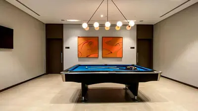 a billiard room with a pool table in it at Near Burj Khalifa - 1BR Apartment in Grande Residence, Downtown - Allsopp & Allsopp in Dubai