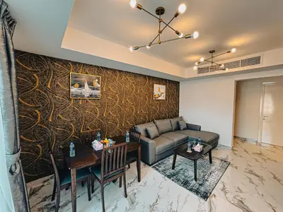 a living room with a couch and a table at The Springs 14-Charming 2-Bedroom Villa in By Al sarya Holiday Home in Dubai