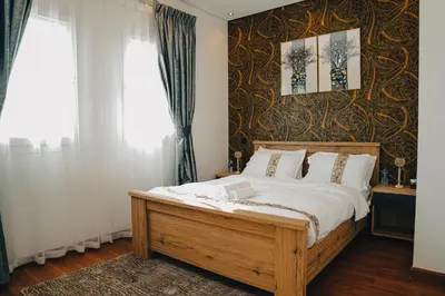 a bedroom with a large bed with white sheets at The Springs 14-Charming 2-Bedroom Villa in By Al sarya Holiday Home in Dubai