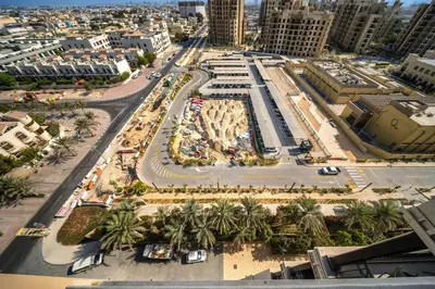 an aerial view of a city with palm trees and buildings at New 1 BD in Madinat Jumeirah Living in Dubai