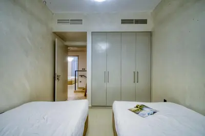 a bedroom with two beds and a closet at Dubai dream villa Emaar in Dubai