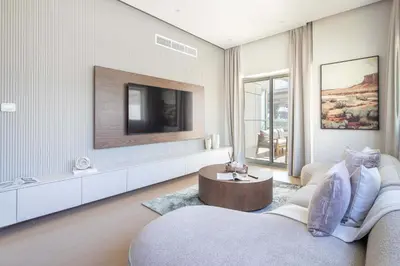 a living room with a tv and a couch at Frank Porter - Zen Tower in Dubai
