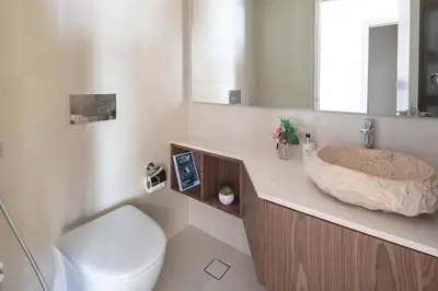 a bathroom with a sink and a toilet at Frank Porter - Zen Tower in Dubai