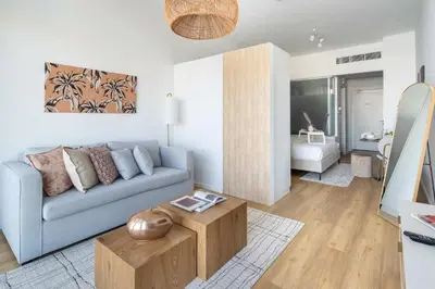 a living room with a couch and a coffee table at Frank Porter - Palm Views East in Dubai