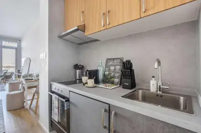 a kitchen with a sink and a counter top at Frank Porter - Palm Views East in Dubai