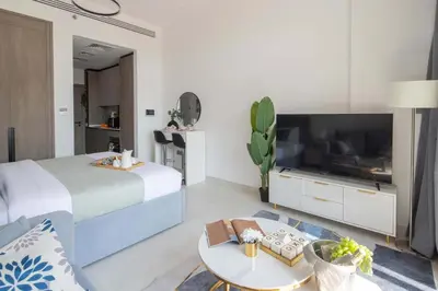 a hotel room with a bed and a tv at Frank Porter - Legacy by Sunrise in Dubai