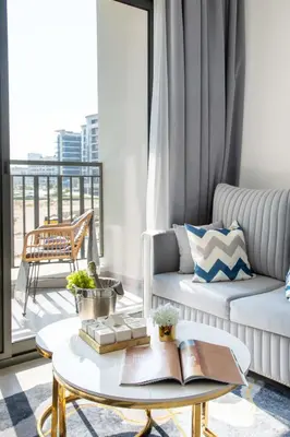 a living room with a couch and a coffee table at Frank Porter - Legacy by Sunrise in Dubai