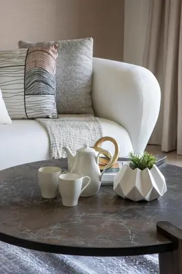 a living room with a coffee table and a couch at Frank Porter - Grande Residence in Dubai