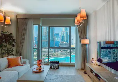 a living room with a large window with a view of a city at DreamShoma-3BR Super Luxurious The Residence 5 Downtown in Dubai