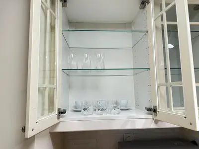 a glass cabinet with wine glasses in it at Rimal 2 JBR Studio 70m2 beach, gym, pool in Dubai