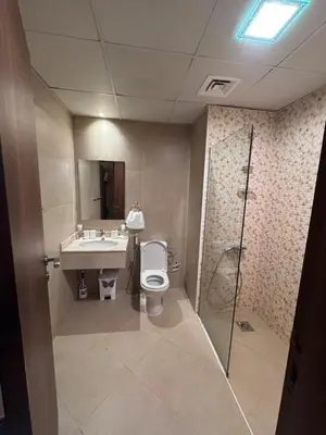 a bathroom with a toilet and a sink and a shower at Live a life of luxury in Dubai