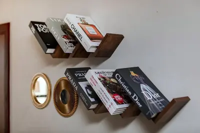 a group of books on a wall at Cozy 1BR apartment in JBR in Dubai