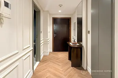 a hallway with a door and a wooden floor at Chic 1 Bedroom Apartment in Dubai Marina, Marina View, Near JBR in Dubai