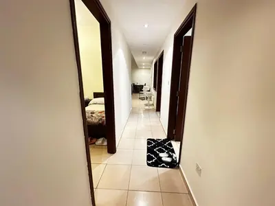 a hallway with a mirror in a hotel room at Spacious bedroom with easy access to the tram and beach, located near JBR Walk in Dubai