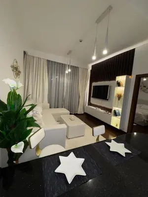 a living room with stars on the floor at Brand New Apartment IN JVC in Dubai