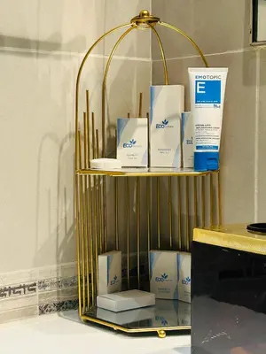 a gold shelf with products on top of it at MontRose Residence Tower A in Dubai