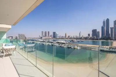 a balcony with a view of a river and buildings at Frank Porter - Sunrise Tower in Dubai