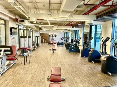 a gym with many treadmills and exercise bikes at NEW Exceptional Lagoon View - 2 Stylish Bedrooms in Dubai