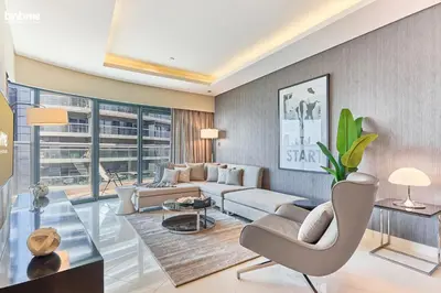 a living room with a couch and a table at bnbmehomes - DAMAC Towers Paramount in Dubai
