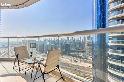 a balcony with a view of a city skyline at bnbmehomes - DAMAC Towers Paramount in Dubai