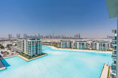 an aerial view of the water in a city with tall buildings at Superb 1 Bedroom with Burj Khalifa and Lagoon View in Dubai