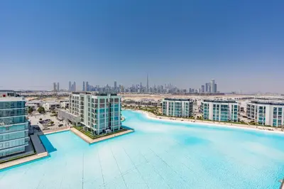 an aerial view of a city with tall buildings at Superb 1 Bedroom with Burj Khalifa and Lagoon View in Dubai