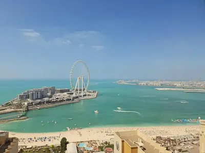 a view of a beach with a ferris wheel in the water at GuestReady - Enchanting retreat in JBR in Dubai