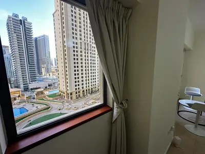 a window in a room with a view of a city at HOT MASTER BED ROOM - JBR WALK Marina in Dubai