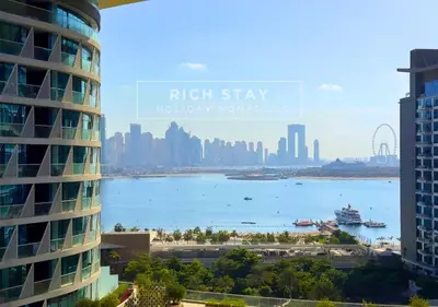 a view of the city from a high stay holiday homesite at Seven Palm Escape 1BR in Palm Jumeirah in Dubai