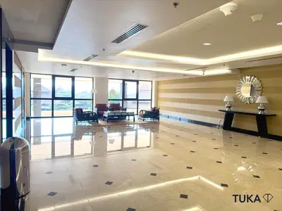a large room with a lobby with tables and chairs at Private Beach - 1-BHK - Palm Jumeirah - Resort in Dubai