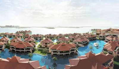 an aerial view of a resort with buildings at Private Beach - 1-BHK - Palm Jumeirah - Resort in Dubai