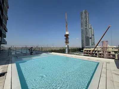 a swimming pool on the roof of a building at Magnificent - New Modern 1BR in Binghatti Heights in Dubai