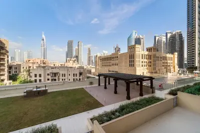 a picnic table on the roof of a building at 2BR plus Maid Bellevue Tower 1, Burj Khalifa View in Dubai