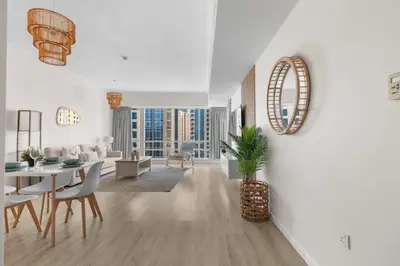 a living room with a table and a dining room at Superb Marina Views I Sleeps 5 in Dubai