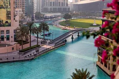 a bridge over a river in a city with buildings at Heart of Dubai in Dubai