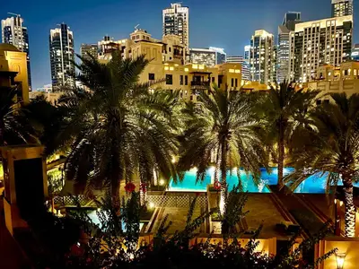 a view of a city with palm trees and buildings at 1001 Nights - Luxury 1-BR apartment near Burj in Dubai