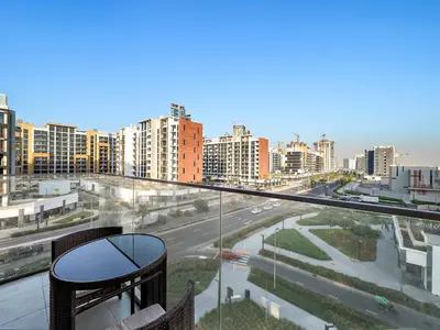 a balcony with a view of a city at Studio Azizi Riviera 35, Community View in Dubai
