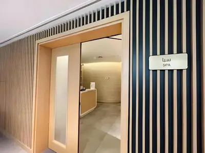 a hallway with a sign that reads lunch star at Palm Jumeirah - Private Beach & Free Infinity Pool in Dubai