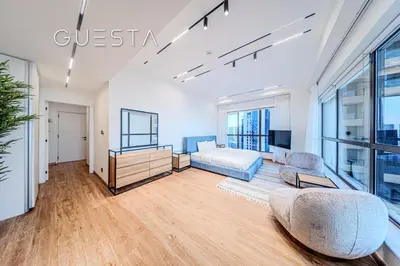 a living room with a couch and a tv at Jumeirah Beach Residence - Rimal 6, Dubai Marina in Dubai