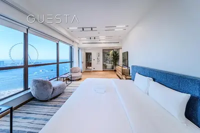 a hotel room with a bed and a view of the ocean at Jumeirah Beach Residence - Rimal 6, Dubai Marina in Dubai