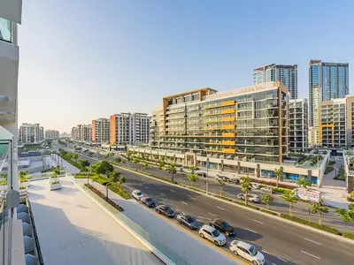an aerial view of a city with cars parked on a street at Tranquil Studio Getaway in Meydan City in Dubai