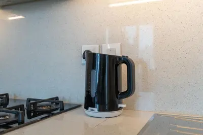 a coffee pot sitting on a counter next to a stove at Luxury Apartment in the Heart of Downtown Dubai in Dubai
