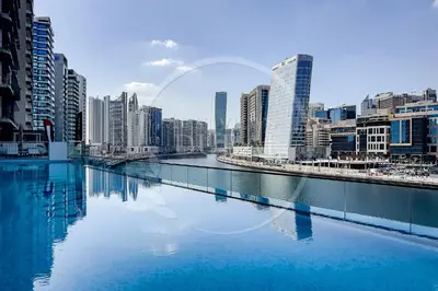 a view of a river in a city with tall buildings at Luxury 2Bdr Apartment in Business Bay in Dubai