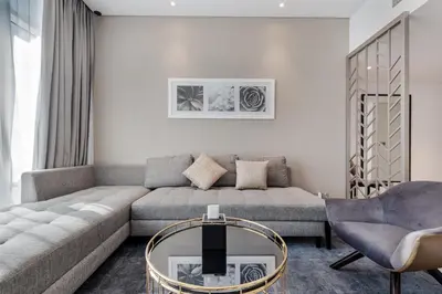 a living room with a couch and a coffee table at Modern 2-Bedroom Apartment Near Burj Khalifa & Dubai Mall in Dubai